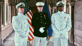 From left, Navy Ensign William Wilkinson ’20, U.S. Marine 2nd Lt. Fletcher Kirol ’20 and Navy Ensign Marcus Hussey ’20 pose at the Cornell War Memorial during their commissioning ceremony May 22.